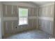 Bright bedroom with natural light showcases unfinished walls and ample space, ready for customization at 2991 Inheritance Rd., Conway, SC 29527