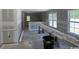 Spacious living room with ample natural light from large windows, showcasing unfinished walls and open layout at 2991 Inheritance Rd., Conway, SC 29527