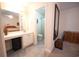 Bright bathroom featuring a spacious vanity and open doorway to a full-size toilet and shower at 331 Andorra St., Longs, SC 29568