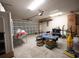 An organized garage with ample storage space and an open garage door at 331 Andorra St., Longs, SC 29568