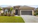 Charming home featuring a brick facade, well-maintained lawn, and an attached two-car garage at 331 Las Olas Dr., Myrtle Beach, SC 29577