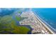Stunning aerial view captures a town nestled between vibrant waterways and ocean at 3316 Bay View Ct., North Myrtle Beach, SC 29582