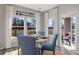 Cozy dining area with natural light, stylish chairs, and picturesque backyard view at 3316 Bay View Ct., North Myrtle Beach, SC 29582