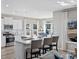 Bright kitchen with white cabinets, a large island, and modern stainless steel appliances at 3316 Bay View Ct., North Myrtle Beach, SC 29582