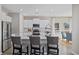 Well-lit kitchen with a central island, stainless steel appliances, and stylish gray barstools at 3316 Bay View Ct., North Myrtle Beach, SC 29582