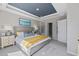 Spacious main bedroom with a tray ceiling, soft lighting, and an ensuite bathroom at 3316 Bay View Ct., North Myrtle Beach, SC 29582