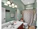 Bathroom featuring a single sink vanity, ceramic tile floors and neutral green walls at 4016 Atalaya Pl., Myrtle Beach, SC 29579