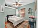 Cozy bedroom featuring a ceiling fan, a patterned rug and light green walls at 4016 Atalaya Pl., Myrtle Beach, SC 29579
