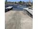 Concrete boat ramp leading into a waterway with docks and waterfront homes at 4016 Atalaya Pl., Myrtle Beach, SC 29579