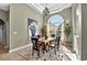 Elegant dining room featuring large arched window and stylish chandelier at 4016 Atalaya Pl., Myrtle Beach, SC 29579