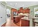 Bright, well-lit kitchen featuring custom cabinets and an island, and open to breakfast nook at 4016 Atalaya Pl., Myrtle Beach, SC 29579