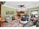 An open living room showcases hardwood floors, stylish furniture, and seamless flow to the kitchen and outdoor spaces at 4016 Atalaya Pl., Myrtle Beach, SC 29579