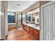 The main bathroom features double sinks, a separate shower, and a soaking tub, creating a spa-like retreat at 4016 Atalaya Pl., Myrtle Beach, SC 29579
