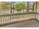 View from the balcony showing a street with mature trees and adjacent buildings at 404 72Nd Ave. N # 206, Myrtle Beach, SC 29572
