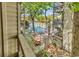 Balcony view of the community pool, landscaping, and building at 404 72Nd Ave. N # 206, Myrtle Beach, SC 29572