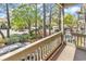 Cozy balcony with a neighborhood view, surrounded by lush greenery, offering a serene outdoor retreat at 404 72Nd Ave. N # 206, Myrtle Beach, SC 29572