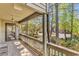 View from condo balcony with outside seating area and shaded trees, overlooking community parking at 404 72Nd Ave. N # 206, Myrtle Beach, SC 29572