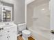 Bathroom featuring a shower and tub combination, white toilet and sink, and wood-look flooring at 404 72Nd Ave. N # 206, Myrtle Beach, SC 29572