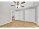 Bedroom featuring wood floors, ceiling fan, large closets, and two entryways at 404 72Nd Ave. N # 206, Myrtle Beach, SC 29572