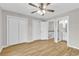 Bedroom featuring light wood floors, neutral walls, closet, and entrance to the bathroom at 404 72Nd Ave. N # 206, Myrtle Beach, SC 29572