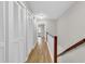 Bright hallway with wood floors, closet and access to other rooms in the home at 404 72Nd Ave. N # 206, Myrtle Beach, SC 29572