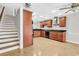Updated kitchen with wood cabinets and stainless-steel appliances, plus stairs to the next level at 404 72Nd Ave. N # 206, Myrtle Beach, SC 29572