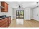 Well-lit kitchen features sleek countertops, ample cabinetry, and seamless access to the deck through sliding glass doors at 404 72Nd Ave. N # 206, Myrtle Beach, SC 29572