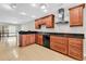 Modern kitchen design featuring wood cabinets, granite countertops and stainless steel appliances, ready for culinary explorations at 404 72Nd Ave. N # 206, Myrtle Beach, SC 29572