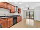 Modern kitchen with black appliances and adjacent access to an outdoor space, perfect for indoor-outdoor living and entertaining at 404 72Nd Ave. N # 206, Myrtle Beach, SC 29572