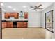 Bright kitchen with stainless steel appliances, wood cabinets and adjacent space for dining or living, ideal for modern living at 404 72Nd Ave. N # 206, Myrtle Beach, SC 29572
