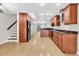 Spacious kitchen with cherry wood cabinetry, granite countertops, and stainless steel appliances, offering a modern design at 404 72Nd Ave. N # 206, Myrtle Beach, SC 29572