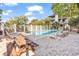 Relaxing community pool area with lounge chairs, picnic table, and a well maintained fence at 404 72Nd Ave. N # 206, Myrtle Beach, SC 29572