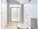 Clean bathroom featuring a glass shower, white toilet, and tiled floor at 4240 Highway 17 Business, Murrells Inlet, SC 29576