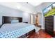 Cozy bedroom showcasing a comfortable bed and hardwood floors at 4240 Highway 17 Business, Murrells Inlet, SC 29576