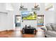 Modern living room with hardwood floors, transom windows and natural light at 4240 Highway 17 Business, Murrells Inlet, SC 29576