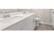 Bright bathroom with double sink vanity, quartz countertops and framed mirrors at 5019 Riverton Ct, Myrtle Beach, SC 29579