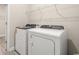 Modern washer and dryer in bright laundry room, with wire rack at 5019 Riverton Ct, Myrtle Beach, SC 29579