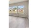 Sunlit living area featuring large windows that offer peaceful views of the surrounding neighborhood at 5019 Riverton Ct, Myrtle Beach, SC 29579