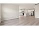 Bright, open-concept living space showcasing hardwood floors that seamlessly connects to the modern kitchen at 5019 Riverton Ct, Myrtle Beach, SC 29579