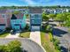 Aerial view of a modern house with vibrant colors in a residential area, featuring a spacious driveway at 524 Farrow Pkwy., Myrtle Beach, SC 29577