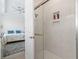 Modern bathroom featuring a glass enclosed shower, alongside a glimpse into the bedroom at 524 Farrow Pkwy., Myrtle Beach, SC 29577