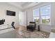 Bright bedroom featuring a desk, chair, television, and a comfortable chair by the window with a view at 524 Farrow Pkwy., Myrtle Beach, SC 29577