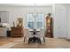 Elegant dining area featuring hardwood floors, a chandelier, and a grandfather clock at 524 Farrow Pkwy., Myrtle Beach, SC 29577