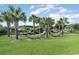 Relaxing hammock garden with lush green lawns and palm trees offers a tranquil escape and leisure at 524 Farrow Pkwy., Myrtle Beach, SC 29577