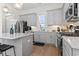 Modern kitchen with stainless steel appliances, gray cabinets and stylish countertops at 524 Farrow Pkwy., Myrtle Beach, SC 29577