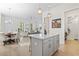 Bright, open kitchen with island, stainless steel appliances, and view to dining and living areas at 524 Farrow Pkwy., Myrtle Beach, SC 29577