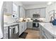 Bright kitchen with white countertops, stainless steel appliances, and gray cabinets at 524 Farrow Pkwy., Myrtle Beach, SC 29577