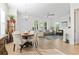 Bright living and dining area with hardwood floors, a fireplace, and stylish decor at 524 Farrow Pkwy., Myrtle Beach, SC 29577
