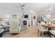 Bright living room with hardwood floors, fireplace, and open floor plan to kitchen and dining at 524 Farrow Pkwy., Myrtle Beach, SC 29577