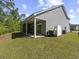Home featuring a covered patio for outdoor relaxation and entertainment, with a spacious backyard at 5333 Abbey Park Loop, Myrtle Beach, SC 29579